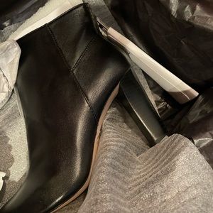 Designer black leather lady’s ankle boots by Brian Atwood. Size 7. New in a box.